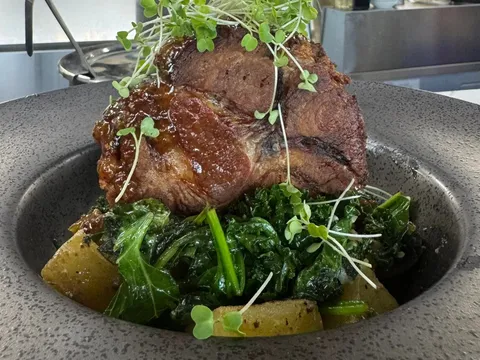 Carlton Farms Pork with roasted potatoes and greens