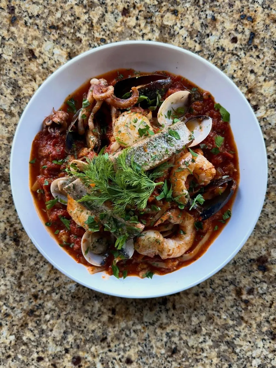 Frutti di mare: clams, shrimp, scallops and calamari over fettuccini