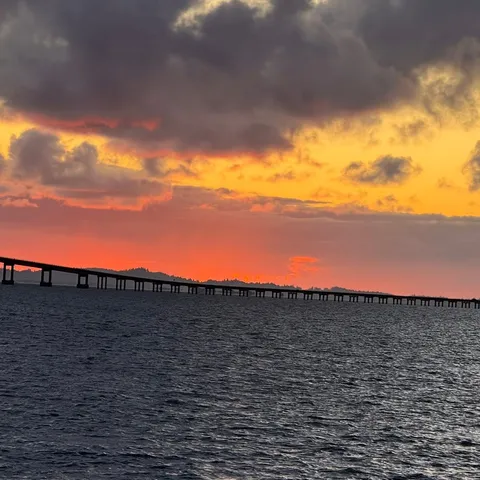 Sunset over the Columbia River with the Astoria–Megler Bridge on the horizon